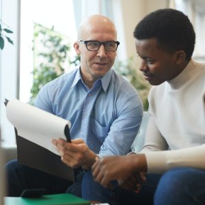 Business People Discussing Documents