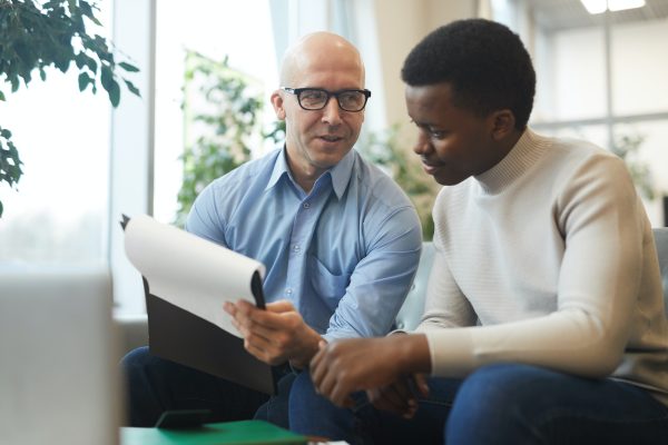 Business People Discussing Documents