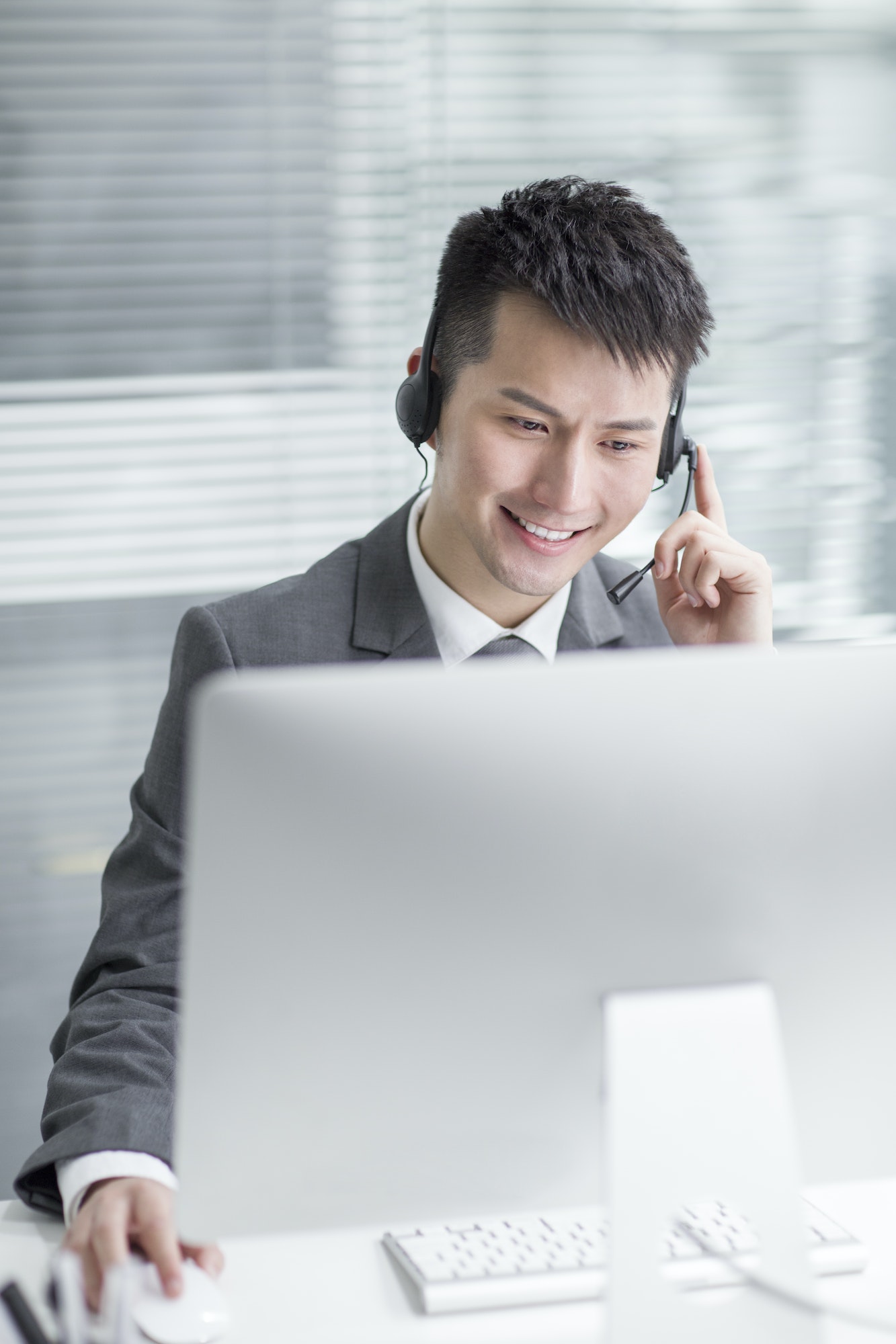 Businessman working in office with headset