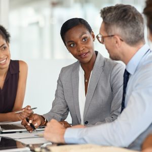 Businesswoman executive explaining graphs in meeting