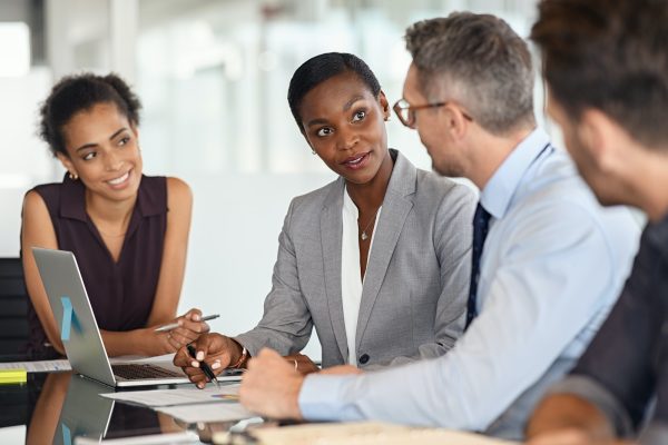 Businesswoman executive explaining graphs in meeting