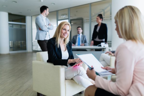 Picture of attractive saleswoman working in office